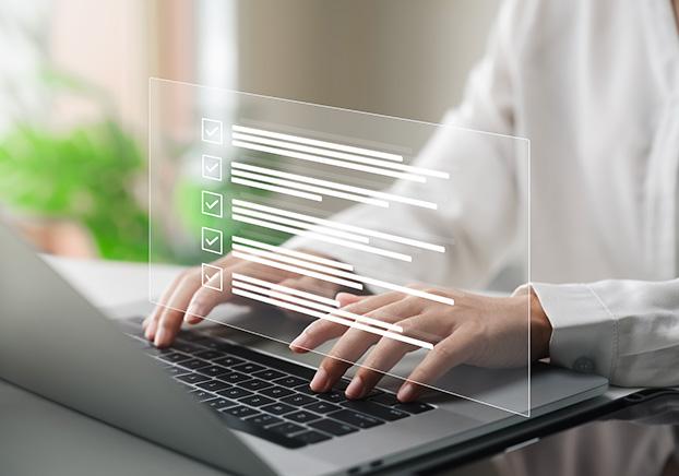 person taking online test on laptop